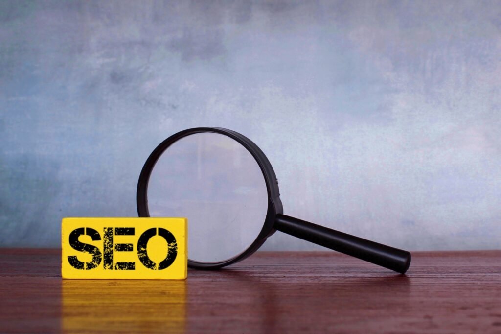 Boost Local SEO in 2023: Tips for South African Businesses 3 SEO A magnifying glass with the word SEO on it, offering insights to improve local SEO in 2023.